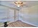 Bedroom featuring wood-look vinyl flooring and two closets for ample storage at 13495 Newport Ave, Port Charlotte, FL 33981
