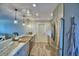 Modern kitchen with stainless steel appliances, granite countertops, and pendant lighting at 13495 Newport Ave, Port Charlotte, FL 33981