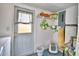 Functional laundry area with modern appliances, shelving, and patterned floors at 13495 Newport Ave, Port Charlotte, FL 33981