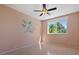 Cozy bedroom with laminate flooring, natural light, and a calm, inviting atmosphere at 13783 Palmetto Point Ct, Port Charlotte, FL 33953