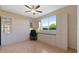 Comfortable bedroom with custom built-ins, desk space, and plenty of natural light at 13783 Palmetto Point Ct, Port Charlotte, FL 33953