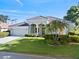 Lovely single-story home with well-manicured lawn, tile roof and beautiful landscaping at 13783 Palmetto Point Ct, Port Charlotte, FL 33953