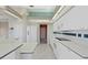 Well-lit kitchen boasting white appliances, ample counter space, and tiled backsplash at 13783 Palmetto Point Ct, Port Charlotte, FL 33953