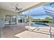 Screened-in pool area with an inviting pool, surrounding brick patio, and outdoor space at 13783 Palmetto Point Ct, Port Charlotte, FL 33953