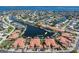 Aerial view of waterfront community with private docks and serene canals, near open water at 143 Tropicana Dr # 1012, Punta Gorda, FL 33950