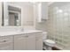 Bathroom featuring updated vanity, fixtures, and glass block wall at 143 Tropicana Dr # 1012, Punta Gorda, FL 33950