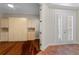 This bedroom features hardwood floors, built-in storage, a ceiling fan and French doors leading to the outside patio at 143 Tropicana Dr # 1012, Punta Gorda, FL 33950