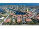 Aerial view of a waterfront community with beautiful homes, lush landscaping, and access to the water at 143 Tropicana Dr # 1012, Punta Gorda, FL 33950