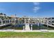 Waterfront view of boat dock with lifts and waterfront homes beyond offers a relaxing marina lifestyle at 143 Tropicana Dr # 1012, Punta Gorda, FL 33950