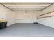 Spacious garage with built-in cabinets and shelving for organized storage, a functional and practical space at 143 Tropicana Dr # 1012, Punta Gorda, FL 33950