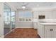 Bright kitchen featuring white cabinets, stainless steel appliances, and views to the patio at 143 Tropicana Dr # 1012, Punta Gorda, FL 33950