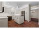Bright kitchen with white cabinetry, stainless steel appliances, and center island at 143 Tropicana Dr # 1012, Punta Gorda, FL 33950