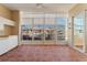 Enclosed lanai with tile flooring and a view of the marina with boats docked along the water at 143 Tropicana Dr # 1012, Punta Gorda, FL 33950