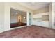 Large lanai featuring tile flooring, a wet bar, and sliding glass doors opening to the living area at 143 Tropicana Dr # 1012, Punta Gorda, FL 33950