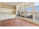 Lanai offering white cabinetry, prep sink, and ample windows offering serene waterfront views at 143 Tropicana Dr # 1012, Punta Gorda, FL 33950