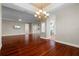 Open-concept layout with hardwood floors connecting the living room, kitchen, and dining area at 143 Tropicana Dr # 1012, Punta Gorda, FL 33950