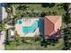 Aerial view of a private pool and spa with a spacious patio area, perfect for outdoor entertaining and relaxation at 143 Tropicana Dr # 1012, Punta Gorda, FL 33950
