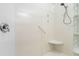 Shower with seat and grab bar; features glass block partition wall at 143 Tropicana Dr # 1012, Punta Gorda, FL 33950