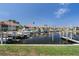 Beautiful waterfront view showcasing boats docked in the marina and waterfront homes under a clear blue sky at 143 Tropicana Dr # 1012, Punta Gorda, FL 33950