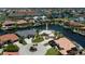 An aerial view of canal-front homes showcases the waterfront community at 1435 Pine Island Ct, Punta Gorda, FL 33950