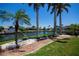 Well-manicured backyard featuring lush tropical landscaping at 1435 Pine Island Ct, Punta Gorda, FL 33950