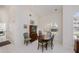 Cozy dining area featuring classic wood table, seating for six, and bright natural light at 1435 Pine Island Ct, Punta Gorda, FL 33950