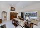 Bright living room with tile floors, neutral furnishings, and view of the screened pool at 1435 Pine Island Ct, Punta Gorda, FL 33950
