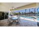 Enjoy the screened in patio that offers views of the pool and surrounding water features at 1435 Pine Island Ct, Punta Gorda, FL 33950