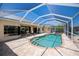 Backyard pool and patio with a screened enclosure for outdoor relaxation and entertainment at 1435 Pine Island Ct, Punta Gorda, FL 33950