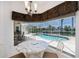 View from breakfast nook of pool and outdoor living area at 1435 Pine Island Ct, Punta Gorda, FL 33950