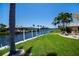 Lush green lawn meets a wide canal at 1435 Pine Island Ct, Punta Gorda, FL 33950