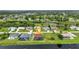 An aerial shot overlooking the backyard of the home, showing the serene canal at 15 Tournament Rd, Rotonda West, FL 33947
