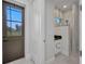 Stylish bathroom with a modern vanity, marble-style tiles, and a glass-enclosed shower at 15 Tournament Rd, Rotonda West, FL 33947
