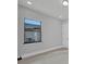 Bright bedroom with window, neutral walls, and modern finishes at 15 Tournament Rd, Rotonda West, FL 33947