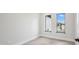 Clean bedroom with tile floors and two windows overlooking the front yard at 15 Tournament Rd, Rotonda West, FL 33947