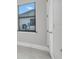 Bedroom with window, neutral walls, and modern finishes at 15 Tournament Rd, Rotonda West, FL 33947