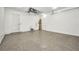 Spacious garage with sealed concrete floors and modern white walls at 15 Tournament Rd, Rotonda West, FL 33947