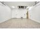 Spacious garage with sealed concrete floors and modern white walls at 15 Tournament Rd, Rotonda West, FL 33947