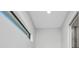 Hallway featuring tile floor and tall narrow window at 15 Tournament Rd, Rotonda West, FL 33947