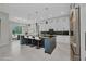 Spacious kitchen with marble countertops, a large island, modern appliances, and a breakfast nook at 15 Tournament Rd, Rotonda West, FL 33947