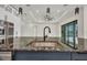 Kitchen island with stainless steel sink, black faucet, and granite countertop at 15 Tournament Rd, Rotonda West, FL 33947