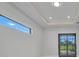 Bright living area with sliding glass doors to the outdoors and a sleek, modern design at 15 Tournament Rd, Rotonda West, FL 33947