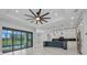 Open living space featuring a kitchen island, dining area, and pool view at 15 Tournament Rd, Rotonda West, FL 33947