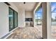A covered patio area with an outdoor kitchen and ceiling fans at 15 Tournament Rd, Rotonda West, FL 33947