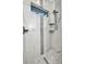 Modern walk-in shower with marble-style tiles, gray accents, and mosaic tile flooring at 15 Tournament Rd, Rotonda West, FL 33947
