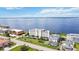Expansive aerial view of a condo building on a scenic coastline with lush landscaping at 1500 Park Beach Cir # 2F, Punta Gorda, FL 33950