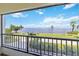Balcony overlooking manicured grounds and waterfront, offering stunning views at 1500 Park Beach Cir # 2F, Punta Gorda, FL 33950