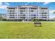 Condo front exterior with beautiful green lawn at 1500 Park Beach Cir # 2F, Punta Gorda, FL 33950