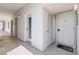 Condo hallway features neutral color scheme with durable flooring at 1500 Park Beach Cir # 2F, Punta Gorda, FL 33950
