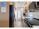 Efficient kitchen design with stainless steel appliances, subway tile backsplash, and a walk-out door at 1500 Park Beach Cir # 2F, Punta Gorda, FL 33950